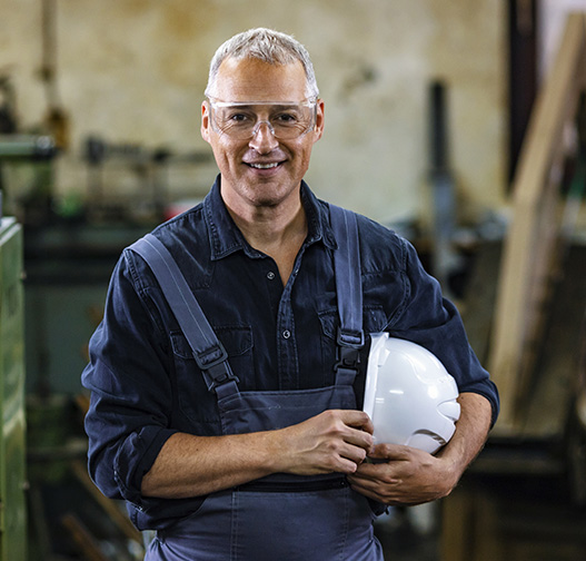 Happy equipment manufacturing employee.