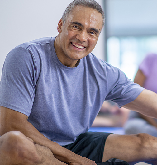 Happy man in the fitness center.