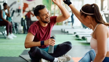 high five at fitness center