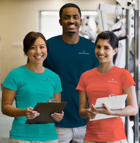 Three young people in an indoor gym